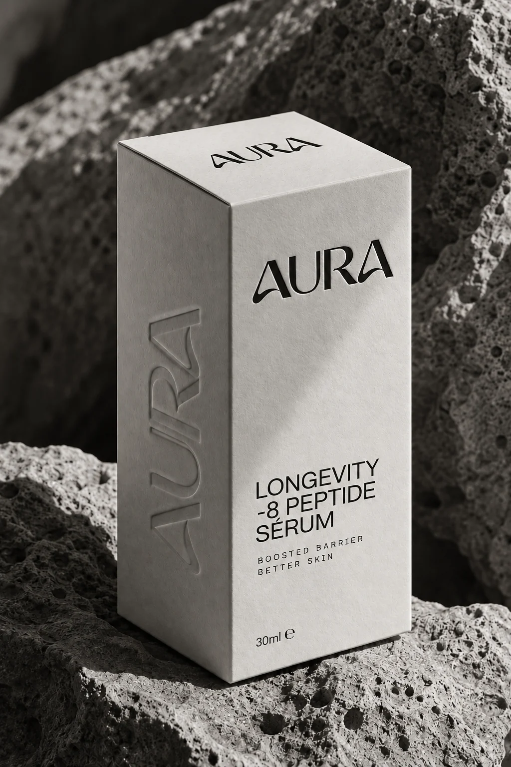 Caja del sérum Aura sobre piedra volcánica